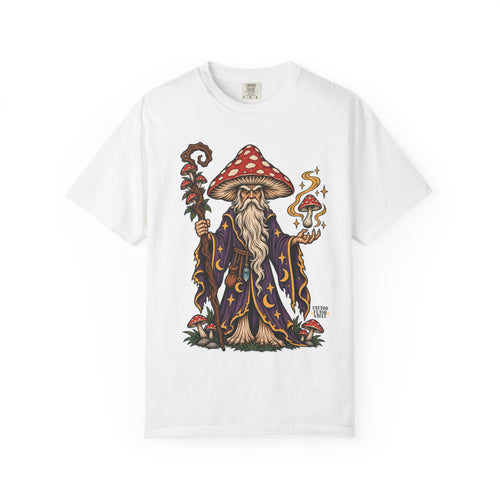 A white short-sleeve crewneck t-shirt featuring a detailed graphic of a fantasy wizard with a red and white spotted mushroom cap, a long white beard, and a dark purple robe decorated with gold stars and swirls.